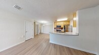 This contemporary apartment in Breyley Apartments offers 850 square feet of well-designed living space. The unit features two bedrooms and two full bathrooms, providing ample privacy and comfort. The heart of the home is an open-concept living area that combines the kitchen and living room, creating a spacious and inviting atmosphere.

The kitchen is a standout feature, boasting light wood cabinetry, stainless steel appliances, and a sleek countertop with a convenient breakfast bar. The galley-style layout maximizes efficiency while maintaining an open feel to the adjacent living area.

Throughout the apartment, wood-look flooring adds warmth and durability. Large windows in the bedrooms and living area allow natural light to flood the space, enhancing the bright and airy ambiance. The bathrooms are clean and modern, featuring white fixtures and tiled surroundings.

The primary bedroom is generously sized at 200 square feet, offering ample space for a comfortable retreat. Both bedrooms include closet space for storage. The overall design of the apartment emphasizes functionality and contemporary style, making it an ideal choice for those seeking a modern living experience in a well-appointed space.