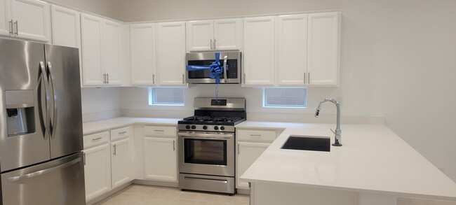 Kitchen w/ All Stainless Steel Appliances - 9530 E Tesla Ave