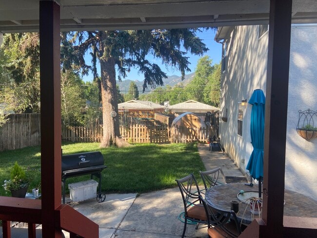 Backyard with urban farm area in back - 2921 W Platte Ave