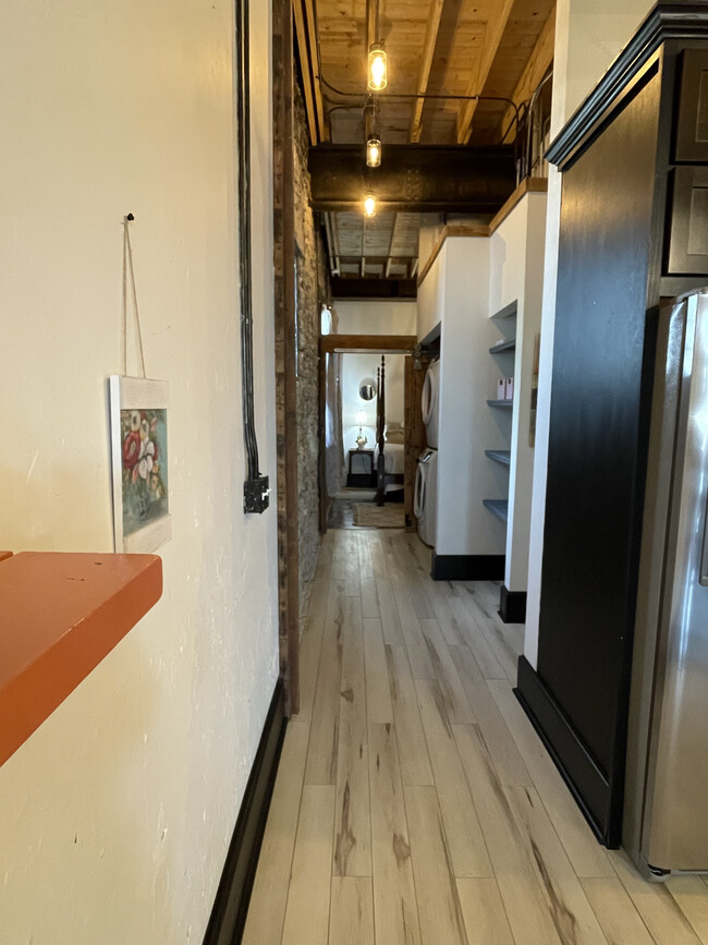 Hallway with washer/dryer in unit - 713 S. Baker St.