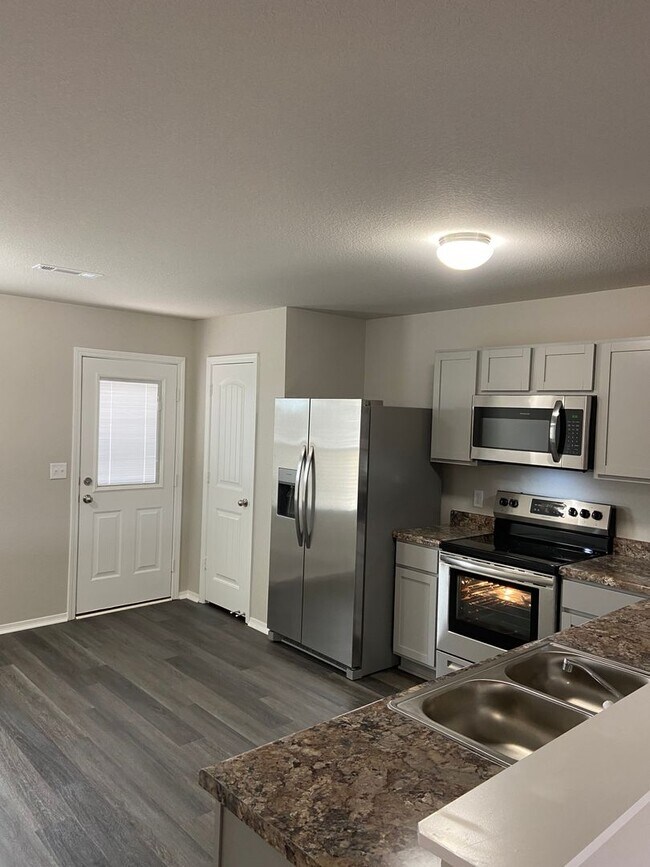 Building Photo - *Rent FREE + Amazon Cash!*  Four Bedroom | Two Bathroom Home in Conrad Court