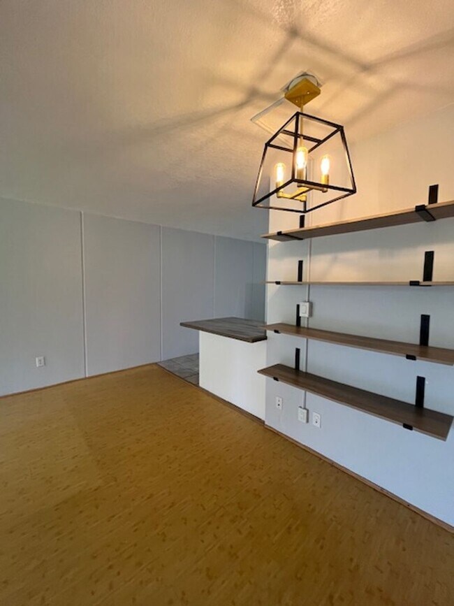 Building Photo - 2 bedroom/1 bath Ground-level unit nestled...