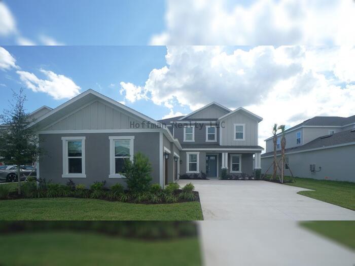 Foto principal - Stunning 5-Bedroom Lakeview Home in River Landing, Wesley Chapel
