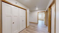 Located at 543 N Alexander in Ellsworth, Wisconsin, this well-appointed 3-bedroom, 2-bathroom single-floor residence offers a functional and cohesive layout designed for comfortable living. Light-toned luxury vinyl plank flooring flows consistently throughout the entire space, complemented by warm wood-trimmed doorways and clean white walls that create a bright, neutral aesthetic.

The open-concept kitchen and living area serves as the heart of the home. The kitchen is outfitted with light maple cabinetry offering generous storage, light-toned countertops, and a full suite of stainless steel appliances including a refrigerator, range, over-the-range microwave, and dishwasher. A window above the sink and a glass door provide natural light and outdoor access.

Each of the three bedrooms is a comfortable size, with the spacious primary bedroom featuring a ceiling fan and a large window with outdoor views. The additional bedrooms also include ceiling fans, natural light, and ample closet space — with bifold-door closets featured throughout. Three closets in total ensure excellent storage capacity across the unit.

The two bathrooms are finished with light wood vanities, chrome fixtures, and wall-mounted towel bars. A dedicated laundry room and a connecting hallway round out this practical and move-in-ready home.