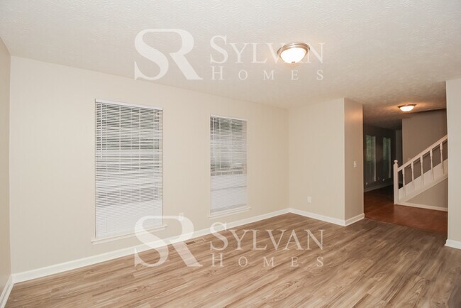 Building Photo - Fall in love with this spacious 4BR 2.5BA ...