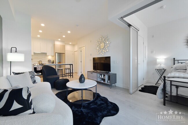 Photo du bâtiment - Fully Furnished 1 Bedroom Condo at Salt & Meadow — Walk-Out Backyard, Water Views & Resort-Style ...