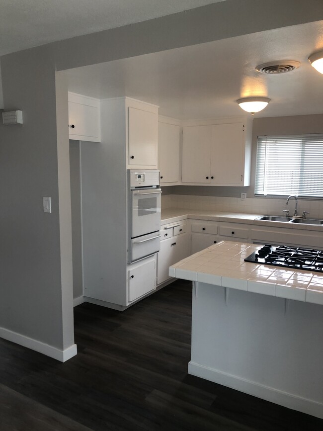 Great light window above sink and huge slider on eat in Kitchen area. - 208 Craig Ct