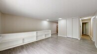 Located at 11 Farnsworth Dr in Slingerlands, NY, this single-floor, 2-bedroom, 1-bathroom home offers a well-organized and functional layout. The living room serves as the centerpiece of the home, featuring light hardwood-style flooring, neutral beige walls, and a sliding glass door that opens to a balcony, flooding the space with natural light and outdoor views of lush greenery. Built-in shelving along one wall adds practical storage and display options. The kitchen is efficiently designed in an L-shaped configuration, showcasing white cabinetry, light countertops, and a full suite of stainless steel appliances including a refrigerator, dishwasher, and electric range. Light wood-style flooring carries through this area, complementing the clean, bright aesthetic. Both bedrooms are carpeted and feature neutral tones, offering a comfortable and quiet retreat. The spacious primary bedroom includes a sliding closet, while the second bedroom also benefits from closet storage. One bedroom enjoys a large window with views of the surrounding trees, enhancing the sense of connection to the outdoors. Baseboard heating is present throughout. The full bathroom is clean and simply appointed with a tub and shower combination. The overall ambiance is understated, functional, and move-in ready.