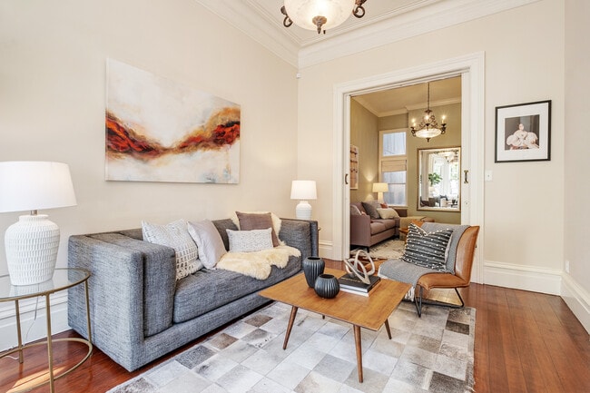 Front Downstairs Double Living room separated by original pocket doors over 12 ft tall - 2188 Sutter St