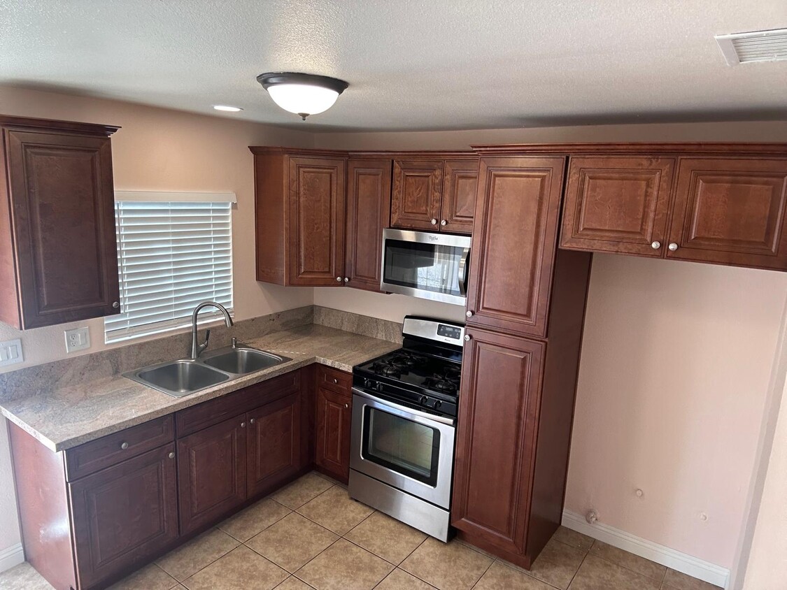 Kitchen with new cabinets and countertop - 1654 E Ontario Ave