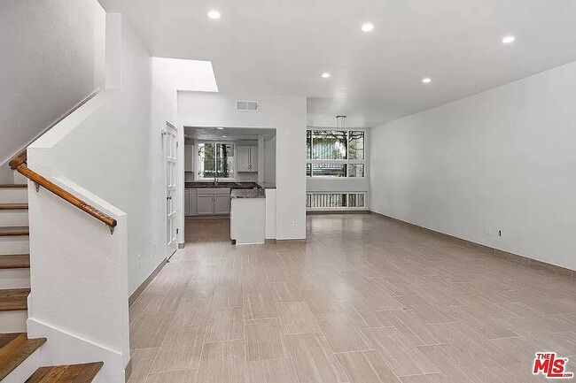 Upon entry into the Unit, you see an Open Floor Plan with Living Room, Dining Room, and Kitchen. - 10315 Missouri Ave