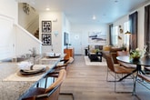 This contemporary 1300 sq ft home in Aurora, CO, boasts a thoughtful two-story layout with 3 bedrooms and 3 bathrooms. The ground floor spans 490 sq ft, while the upper level offers 820 sq ft of living space. The heart of the home is an open-concept design, seamlessly connecting the kitchen and living areas. The kitchen features sleek cabinetry, granite countertops, and stainless steel appliances, complemented by a practical island with seating. Warm wood-look flooring flows throughout, creating a cohesive aesthetic. The primary bedroom, a spacious 190 sq ft retreat, showcases a plush upholstered headboard and ample natural light. Bathrooms are modern and functional, with clean lines and contemporary fixtures. A dedicated laundry room adds convenience. The living room is adorned with stylish artwork and comfortable seating, while strategic lighting enhances the ambiance. Closet space and additional storage solutions ensure clutter-free living in this well-designed urban residence.