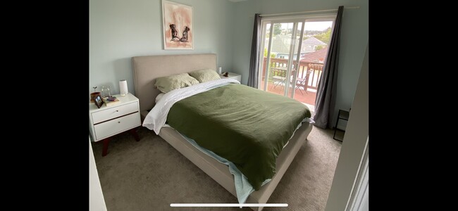 Upstairs bedroom with sliding glass doors to attached deck with view - 5242 Shafter Ave