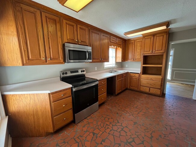 Building Photo - Renovated 4 Bedroom 2 Bath Home with Carport and Double Garage!!