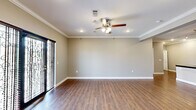 Located at 300 Bruce St in Conway, Arkansas, this well-appointed single-story home offers three bedrooms and two bathrooms across a thoughtfully designed floor plan. Hardwood-style flooring flows throughout the entire residence, complemented by crisp white crown molding and ceiling fans in every room, creating a cohesive and polished aesthetic.

The open living room is a welcoming centerpiece, featuring a tiled fireplace, recessed lighting, and a glass-paneled front door that invites natural light. The kitchen is a true standout, showcasing rich dark-wood cabinetry, dark granite countertops, a white subway tile backsplash, stainless steel appliances, and a large center island with an undermount sink — ideal for both cooking and entertaining.

Each bedroom is generously proportioned, with ceiling fans, natural window light, and ample closet space. The primary bedroom offers a notably spacious layout. The two bathrooms are finished to a high standard, featuring dark wood vanities with granite countertops and granite-surround soaking tubs. One bathroom also includes a glass-enclosed walk-in shower, adding a touch of luxury.

Overall, this home presents a clean, modern interior with quality finishes and a functional, comfortable layout throughout.