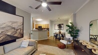 Located at 1904 Parable Way in Cary, NC, this single-story residence offers a thoughtfully designed layout that balances functionality and comfort. The open-concept living, dining, and kitchen area forms the heart of the home, finished with warm hardwood-style flooring, crown molding, and a ceiling fan overhead. A peninsula with a breakfast bar connects the kitchen to the living space, creating an inviting flow ideal for everyday living and entertaining.

The galley-style kitchen is well-equipped with warm wood cabinetry, granite-toned countertops, a tile backsplash, and black stainless appliances, including a range, microwave, refrigerator, and dishwasher. A dedicated laundry area with a full-size Whirlpool washer and dryer is conveniently accessible from the kitchen.

The bedrooms feature plush carpeting, natural light from windows with views of greenery, and walk-in closet access. A versatile flex space with hardwood-style flooring serves well as a home office or additional living area. Both full bathrooms include warm wood vanities, tub-shower combinations, and hardwood-style flooring, providing a clean, cohesive aesthetic throughout the home.