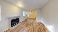 Located in Silverdale, WA, this well-appointed 2-bedroom, 2-bathroom home offers a thoughtfully designed single-floor layout with a clean, modern aesthetic throughout. Light wood-style flooring runs seamlessly through the main living areas, complemented by crisp white walls and textured ceilings that lend the space a bright, airy character.

The living room serves as a central gathering space, highlighted by a tile-surround fireplace and a ceiling fan, with windows that invite natural light. Adjacent to the living area, the kitchen is outfitted with white shaker-style cabinetry, dark countertops, and a full suite of stainless steel appliances including a range, dishwasher, and refrigerator, along with a window above the sink.

The spacious primary bedroom provides a comfortable retreat, while the second bedroom offers flexibility for guests or a home office. Both bathrooms are finished in neutral tones; one features a full tub-shower combination with white tile surround and chrome fixtures.

A dedicated laundry area with a washer and dryer adds everyday convenience, and two closets provide ample storage throughout. A hallway connects the rooms with ease, and a private balcony extends the living space outdoors. This home combines practical functionality with clean, contemporary finishes in a desirable Silverdale location.