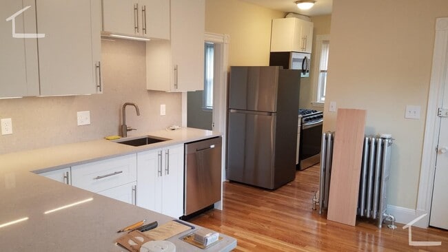 Building Photo - Large, newly renovated 3 bed near the Green Line and Commuter Rail!