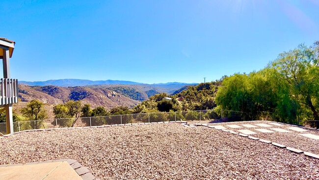 Building Photo - Spacious Two-Story Country Home with Amazing Views Looking out, and Privately Fenced and Gated Ya...