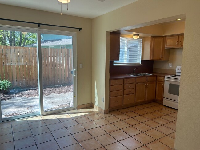 Building Photo - Spacious Townhouse-Style Condo with Patio!...