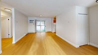 Located at 2 Meadowbrook Cir in Fulton, NY, this single-floor home offers four bedrooms and two full bathrooms across a well-organized layout. Light hardwood flooring runs consistently throughout the entire space, creating a cohesive and clean aesthetic.

The combined kitchen and living area forms the heart of the home. The living room is open and airy, featuring a sliding glass door that invites natural light and provides outdoor access. The kitchen is equipped with warm oak cabinetry, white countertops, and white appliances including an electric range, dishwasher, and refrigerator, offering generous storage and functionality.

Each of the four bedrooms features the same light hardwood flooring and neutral wall tones, with windows fitted with horizontal blinds allowing for adjustable natural light. Baseboard heating units are present throughout the bedrooms. The primary bedroom provides a comfortable and versatile space.

The two bathrooms are clean and simply appointed. One features a white vanity with a medicine cabinet mirror and matte black fixtures, while the other includes a tub-shower combination with bright white surroundings. Both bathrooms continue the warm hardwood flooring seen throughout the home.

Overall, the space presents a bright, neutral, and move-in ready environment with consistent finishes and a practical single-level layout.