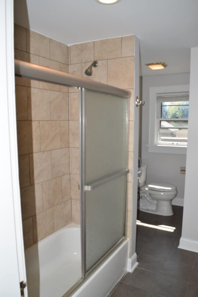 Bathroom with tub - 319 1/2 Jackson St