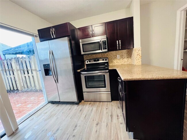 Building Photo - 7060 NW 173rd Dr