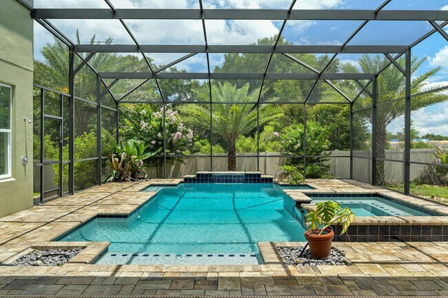 Building Photo - Expansive 4 bedroom, 3 bath remodeled home in gated community