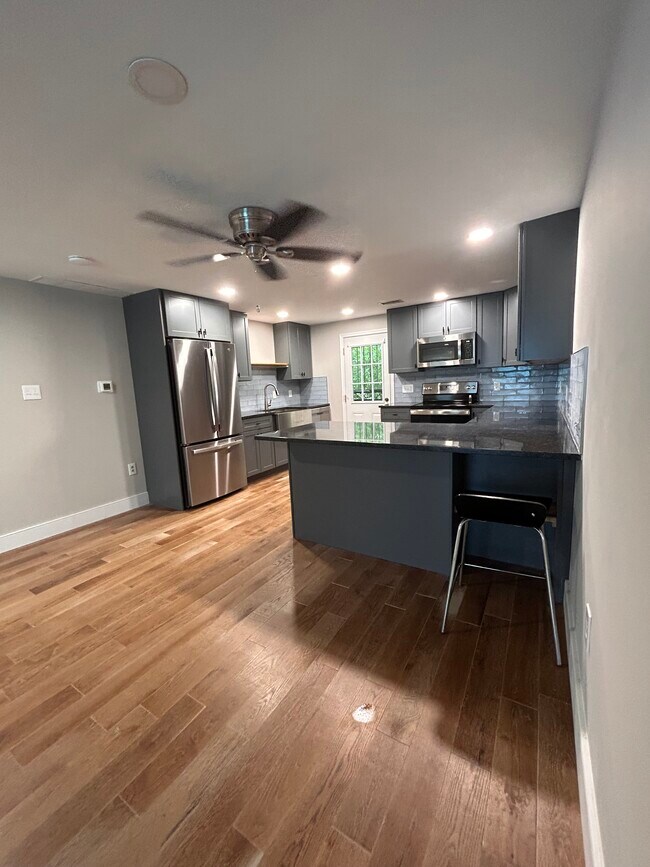 gourmet kitchen with seating and tons of storage - 300 Falcon Ln