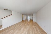 Located at 2501 Avant Ave in Ann Arbor, Michigan, this contemporary 4-bedroom, 3-bathroom home is spread across three well-designed floors. The entry-level floor serves as a functional base, while the main living floor offers a generously sized, open-concept layout. Light wood-tone flooring flows throughout, complemented by crisp white walls and recessed lighting that create a bright, clean aesthetic throughout.

The combined kitchen and living room on the main floor is the heart of the home. The kitchen features white shaker-style cabinetry, granite countertops, stainless steel appliances, and a central island with a built-in sink accented by stylish pendant lighting. A sliding glass door brings in natural light and connects the space to the outdoors.

The upper floor hosts the bedrooms, including a well-proportioned primary bedroom, along with three additional carpeted bedrooms. Each room is finished with neutral tones and ample natural light from large windows with neighborhood views. Three full bathrooms are distributed throughout the home, each featuring clean, modern finishes including glass-enclosed showers. A dedicated laundry room with a full-size washer and dryer, a pantry, and a closet add everyday practicality. A staircase connects all three levels seamlessly.