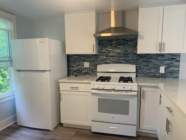 Gas range with new stainless steel hood vent - 50 William St