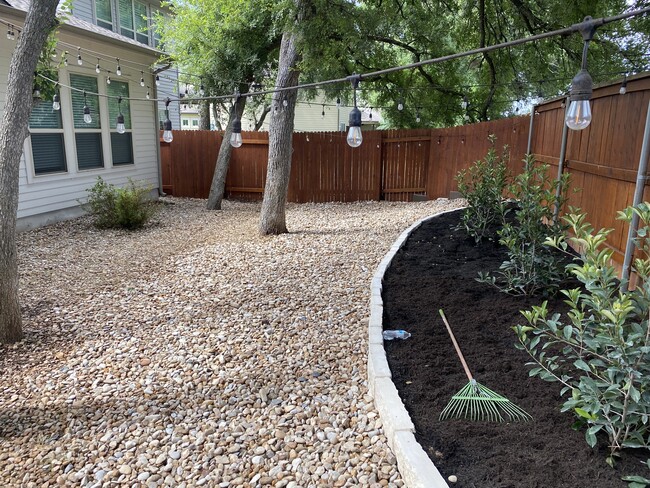 xeriscaped back yard for low maintenance. - 8808 Jodie Ln