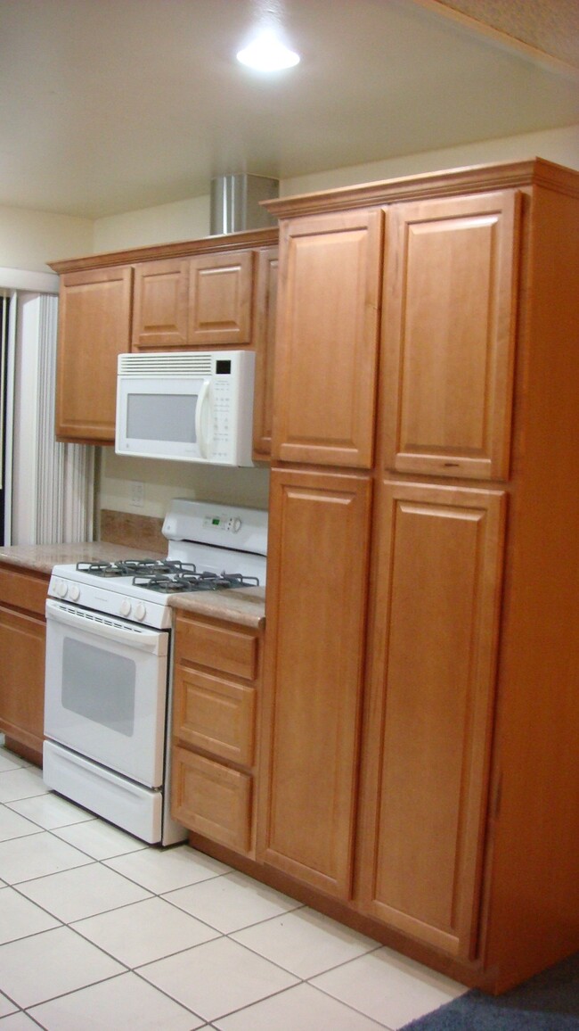 Kitchen range & pantry (now has hardwood laminate flooring) - 2870 N Cottonwood St