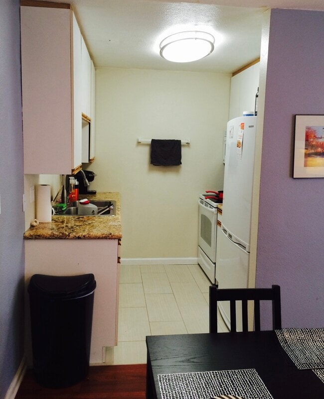 Marvel countertops in the kitchen sit on all new White appliances including a dishwasher - 970 Palm Avenue