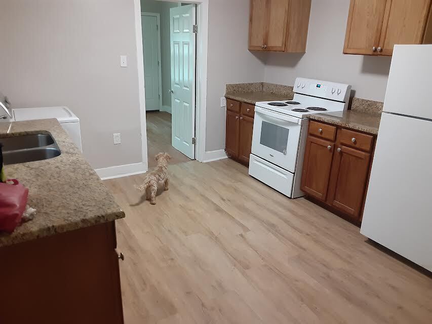 Kitchen features granite countertops. - 2413 Columbus Ave