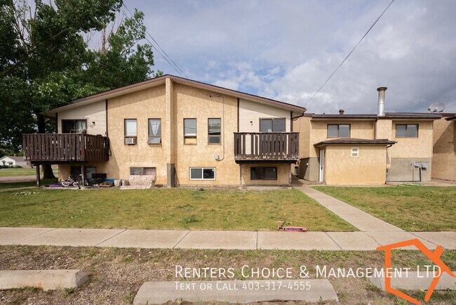 Building Photo - Apartment Near Downtown Taber with Assigned Parking