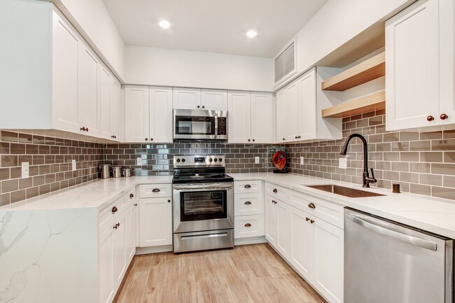 Modern stainless steel appliances with Tile backsplash - Newhall Crossings