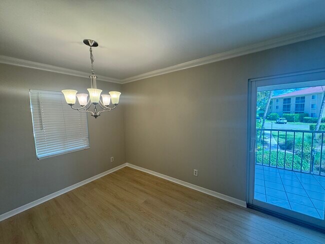 Living Room/ Dining Room with balcony - 1025 Foxfire Ln