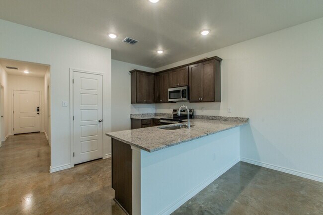 Building Photo - Brand New 3BR Duplex with Modern Concrete Floors & Fenced Yard!