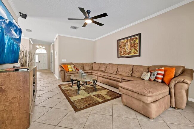 Building Photo - "Stunning 3BR Orlando Home with Private Screened Pool, Spa & Spacious Living Areas"