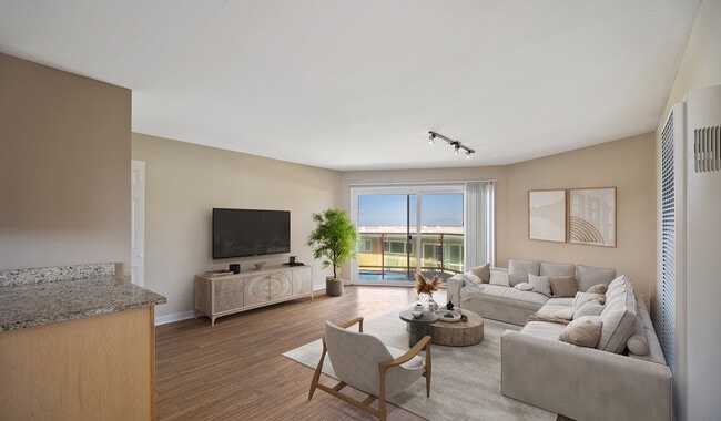 Spacious living roome with wood flooring throughout - The Bluffs At Pacifica
