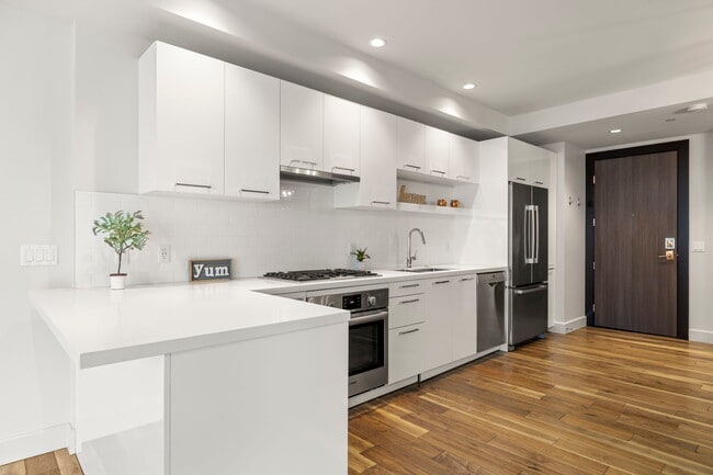 Enter the second floor condo to a light and bright kitchen - 4422 N 75th St