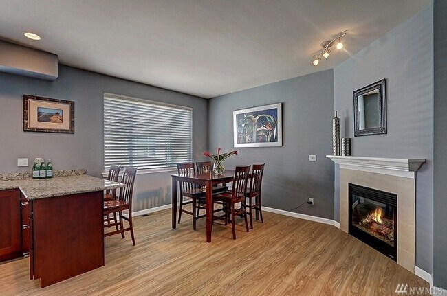 dining space with fireplace - 440 Tacoma Ave NE