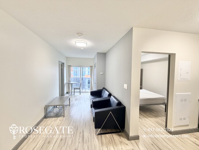 Photo du bâtiment - Modern 2-Bedroom Condo with Balcony in the...