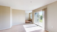 Located at 1124 McGee Ct NE in Salem, Oregon, this single-floor home offers four bedrooms and two bathrooms within a practical and efficiently arranged layout. The living area is bright and open, featuring neutral-toned walls, plush carpeting, and a sliding glass door that fills the space with natural light and provides direct access to the outdoors, where lush greenery is visible.

The kitchen is well-appointed with warm wood cabinetry, laminate countertops, hardwood-style flooring, and white appliances including a range and refrigerator. A window above the dining area allows natural light to pour in, creating an inviting space for meals.

The four bedrooms are carpeted and feature neutral walls with windows fitted with blinds. The primary bedroom includes a closet with built-in shelving, while additional bedrooms offer closet access as well. Throughout, the rooms provide a clean and functional setting adaptable to various needs.

The two bathrooms are finished with tile flooring and warm wood cabinetry. One bathroom features a walk-in shower stall, while the other includes a full soaking tub and shower combination. Both bathrooms offer practical storage solutions. A hallway connects the rooms cohesively, completing this efficiently designed single-story home.
