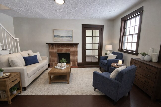 Building Photo - Cozy Akron Home w/ Fireplace Charm, Detached Garage & Back Porch