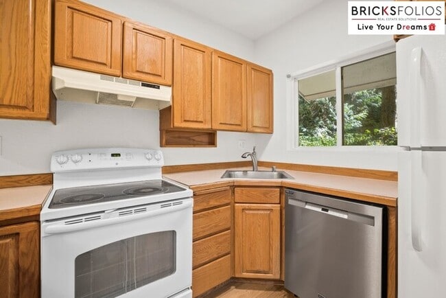 Building Photo - Live Steps from Microsoft | Stylish 2BR Condo with Fireplace & Parking