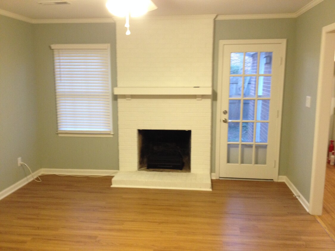 Family Room with Electric Fireplace Logs - 4925 Tower Rd