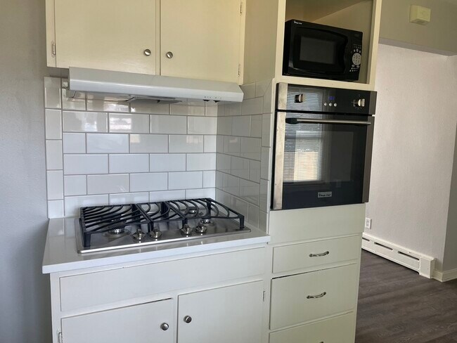 backsplash, tile, oven and gas stove in '23. - 711 7th Ave