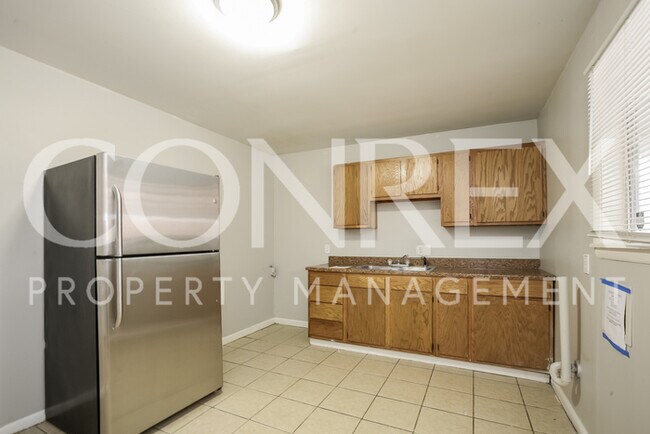 Foto del edificio - 6115 E 39th St